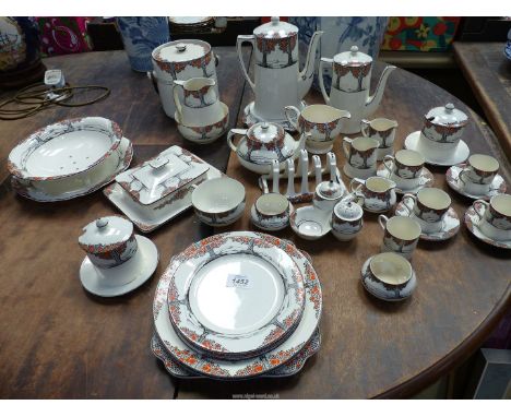 A good quantity of Crown Ducal 'Orange Tree' china including coffee cans and saucers, tea and coffee pots, strainer dish and 