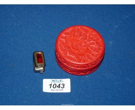 A red Cinnabar Box and cover carved with flowers, with black lacquered interior, 3'' diameter x 1 1/2'' high and a miniature 