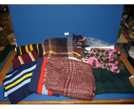 A quantity of miscellaneous fabrics including blankets, scarves, linen tablecloth, tartan cape, etc.