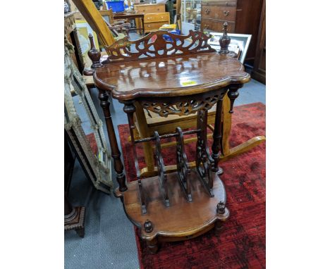 Victorian style mahogany Canterbury table, pierced back flanked by turned finials, with mirrored apron to the shaped top shel