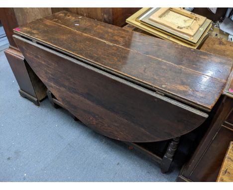 A late 17th Century/early 18th Century oak gateleg dining table on bobbin turned supports. Location;LAM 