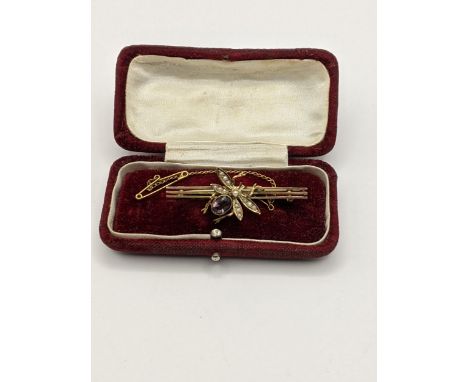 A 9ct gold bar brooch in the form of a bug set with a purple amethyst and seed pearl, total weight 3.6g Location: 