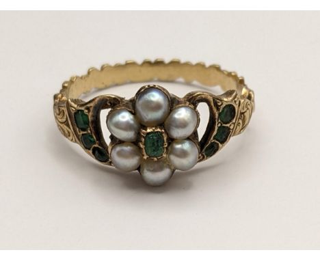 An Edwardian yellow metal emerald and pearl daisy ring, 2.7gLocation: 