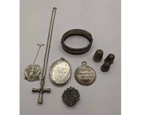 A mixed lot of silver and white metal to include a white metal bangle having initials to the reverse A/F, a silver locket wit