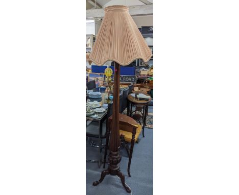 A Victorian mahogany 'bed post' standard lamp having a bulbous support on 3 splayed legs, 164cmH without shade and fitting 