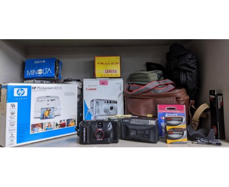 A quantity of vintage cameras and equipment to include a Sigma lens, a Minolta Riva Zoom 115, a Hanimex IC500 and a printer L