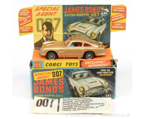 Corgi 261 "James Bond" Aston Martin DB5  taken from the film "Goldfinger" - finished in gold body, red interior with "James B