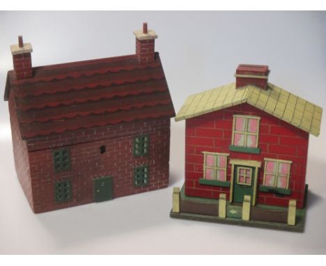 A 19th century Folk Art two-division tea caddy as a two-storey brick-built house, with painted detail, 23cm high; and a simil