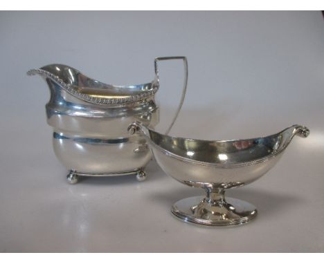 A Georgian silver cream jug, a Georgian silver salt and an unhallmarked dish, 10ozt gross, together with two silver pocket wa