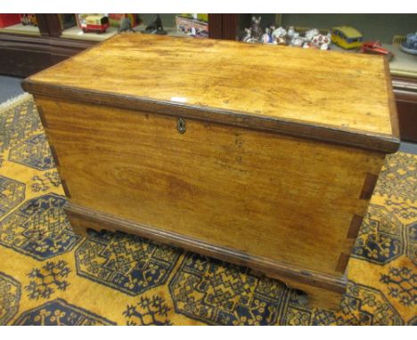 A teak and oak blanket box with hinged lid on bracket feet 59 x 92 x 49cm  