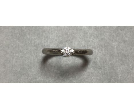 A platinum and single stone diamond ring by Paul Spurgeon, the round brilliant cut diamond tension set in a plain circular se