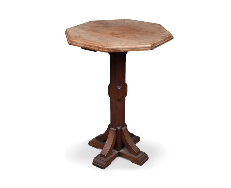A mahogany Gothic revival lamp table, the octagonal top on similarly shaped knopped column and cruciform base, 69 x 50 x 50cm