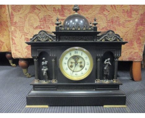 A late 19th French black marble mantle clock with visible escapement 40cm wide  