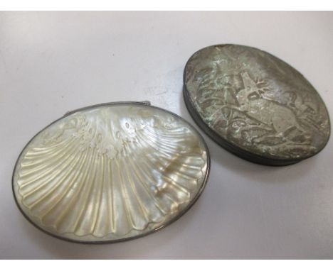 An 18th century mother of pearl and silver mounted oval snuff box, the lid carved with scallop shell design, the base carved 