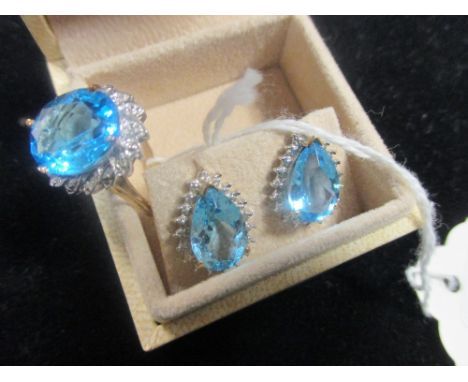 A cased pair of 9ct gold blue and white stone stud earrings and a 9ct gold blue and white stone cluster ring  