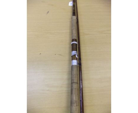 A Bruce & Walker "Spring Spinner" two piece fibreglass spinning rod, together with maker's cloth bag
