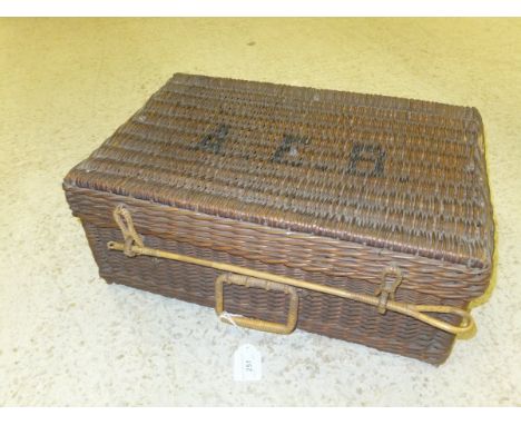 A wicker picnic hamper initialled "AEB" to top, opening to reveal a fitted interior 