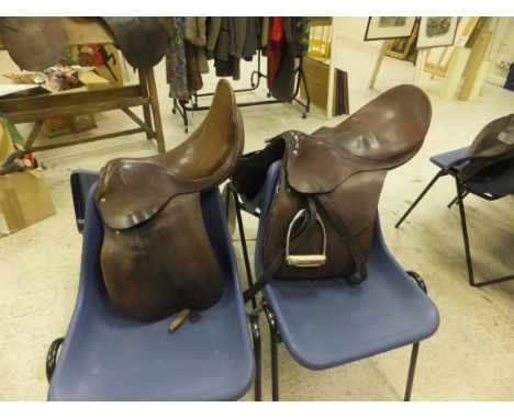 Two general purpose saddles, together with a box containing assorted bits, leading reins, whips, shooting stick, binoculars a