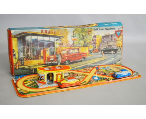 A boxed vintage tinplate clockwork Technofix (W. Germany) #299 Quick Service Filling  Station model, containing tinplate trac