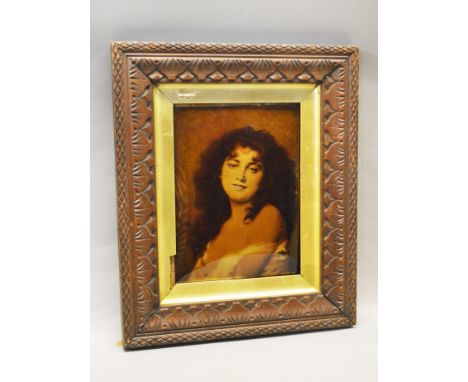 A Crystoleum - portrait of an attractive lady, with period frame. 27cm x 21cm.