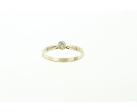 A diamond solitaire ring, the single round brilliant cut diamond approx 0.15cts, tested as 9ct, approx 1.9gms 