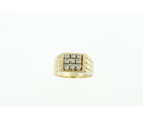A gents diamond set ring, the nine round brilliant cut diamonds total approx 0.54cts, stamped 18k, approx 9gms
