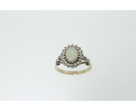 An opal &amp; diamond ring H/M 9ct, the oval opal measures approx 7.8mm x 5.8mm, approx total diamond weight 0.25cts, size M,