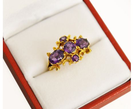 A 9ct H/M yellow gold Amethyst set cluster ring, Makers mark "AC.Co". Size J/K, approx total weight 4.8gms