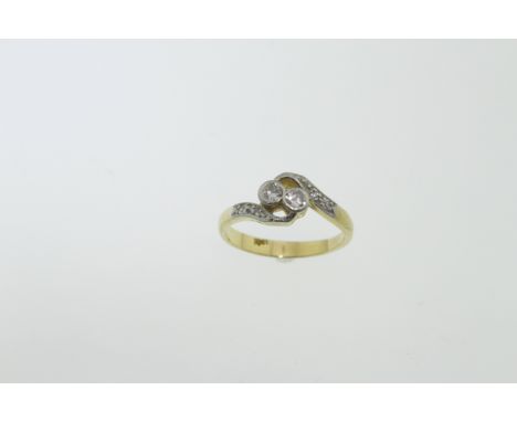 An early 20th Century diamond ring, the round brilliant cut diamonds total approx 0.20cts, stamped 18ct, size M, approx 3.4gm
