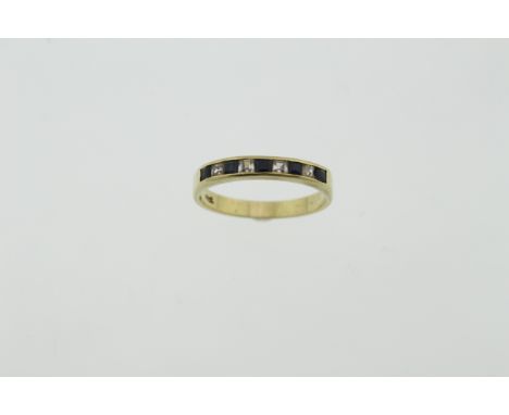 A half eternity ring, stamped 18ct, set with synthetic stones, size M, approx 2.3gms