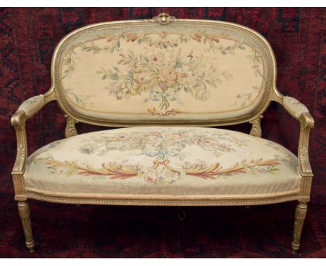 CANAPE, late 19th century French with a giltwood showframe and Aubusson tapestry covers on fluted turned legs, 103cm H x 129c