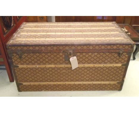 TRUNK, early 20th century Continental with rising lid baton details and leather trim, metal lined, 113cm W x 58cm D x 63cm H,