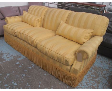 PETER DUDGEON SOFA, three seater, with gold striped upholstery and tasselled fringing, 224cm L. (with faults)