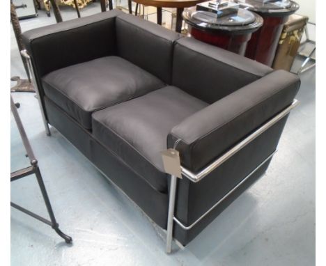 SOFA, two seater, in the style of the LC2 Le Corbusier sofa, in a black leather with chromed tubular construction.