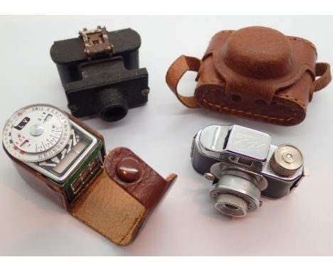 Two vintage miniature cameras and a light meter 