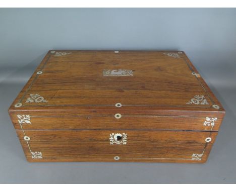 A rosewood and mother of pearl inlaid needlework box with hinged lid opening to reveal fitted interior