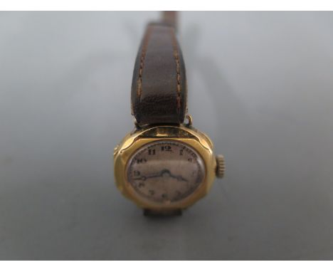 A 9ct yellow gold cased ladies wristwatch Arabic numerals to white dial, manual wind - in working order