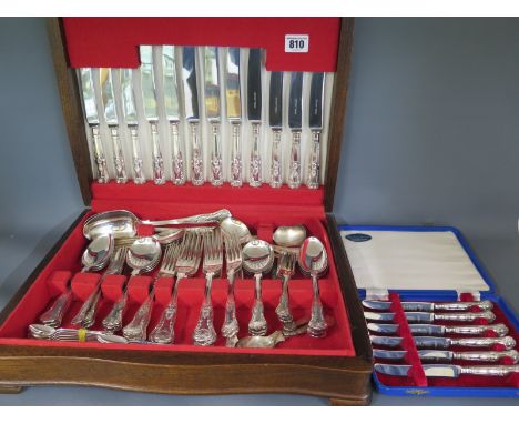 A silver plated canteen of flatware consisting of six dinner knives, six dinner forks, six soup spoons, two serving spoons, s