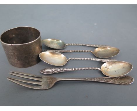 Four silver hallmarked teaspoons, a silver fork and a silver napkin ring - approx weight 3 troy oz - varying condition