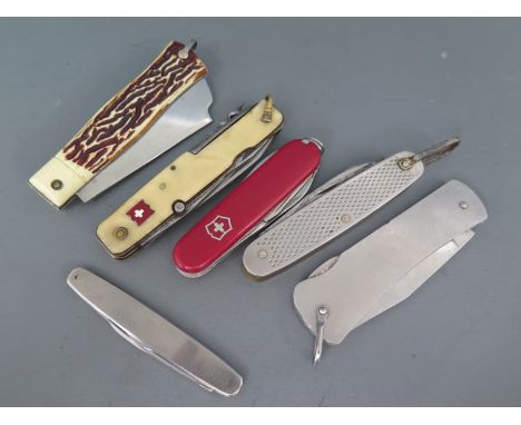 A collection of six pocket penknives to include Swiss Army, USA made, Sheffield made etc.