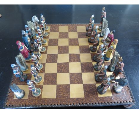 A modern Myth and Magic resin chess set and board - used condition