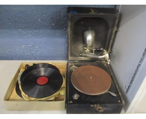 An early 20th century Decca Junior portable gramophone, together with mixed records 