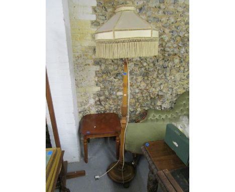 A mahogany effect table lamp with canted corners and inset brass medallions, on turned and fluted legs, along with a mahogany