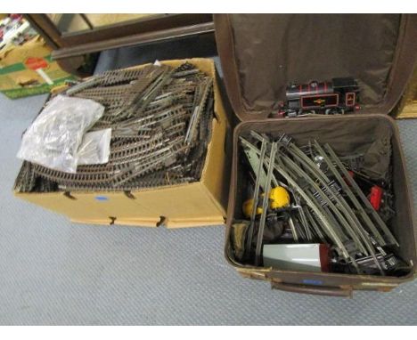 A Hornby Meccano tin plate train set with type 40 engine, wagon and rolling stock and track, along with a box of Hornby Trian