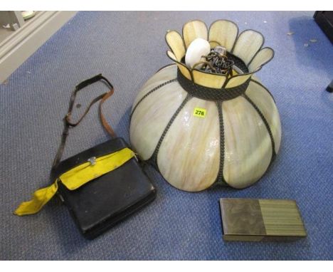 A Tiffany style glass and metal ceiling shade, a cased Canon cine camera and a musical box 