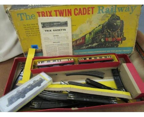 A boxed part complete Trix Twin Cadet railway set, along with a boxed Trix engine 