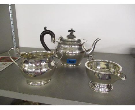 A silver three piece teaset comprising of a milk jug, a sugar bowl and a teapot 