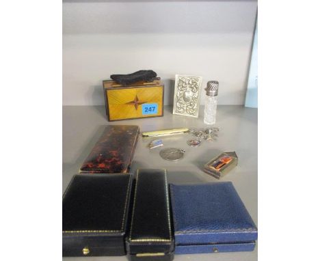 A modern inlaid trinket box containing a fruit knife, a silver topped scent bottle, a white metal lodge medal, a WVS Civil Se