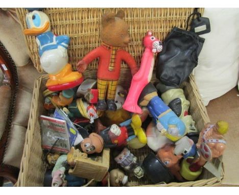 A selection of rubberoid toys and other plastic toys to include Rupert Bear, Donald Duck and Pink Panthers, all held in a wic