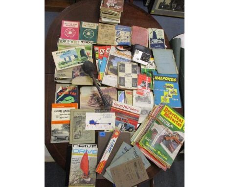 Mid 20th century motoring ephemera, guides and books, together with a Kodak Disc 4000 camera in case and other items 